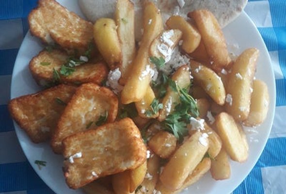 Halloumi served with chips pitta bread sallad and tzatziki dip