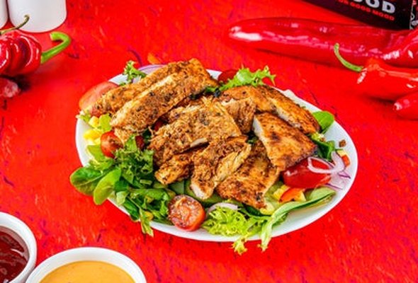 Flame Grill Salad served with a drink.