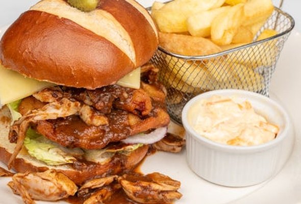 -Clucking big burger, battered chicken breast, pulled chicken mole, pico de gallo, Monterey Jack cheese