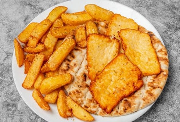 Halloumi Cheese served with chips pitta bread sallad and tzatziki dip