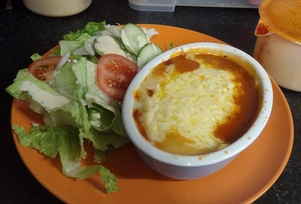Vegetable lasagne with salad garlic slice
