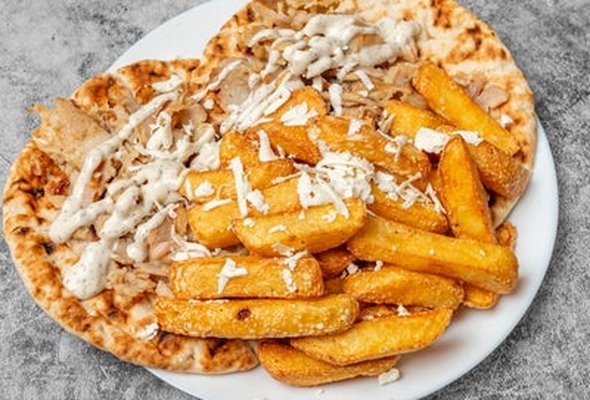 Chicken Gyros served with chips pitta bread sallad and tzatziki dip