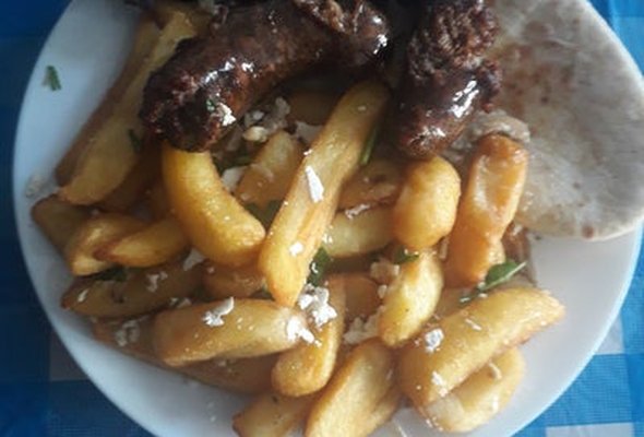 Greek Spicy Loucaniko Sausage served with chips pitta bread sallad and tzatziki dip